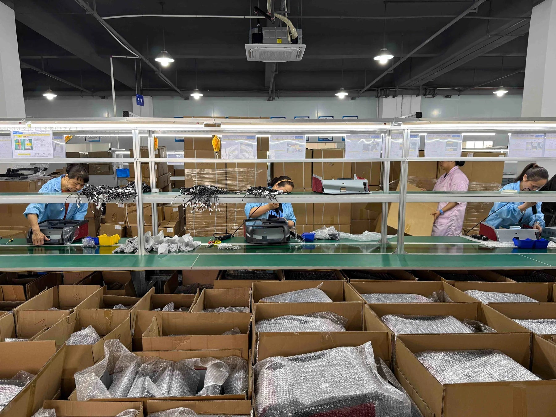 Production staff working at the Jingxi Box Hunan electronics assembly and packing line